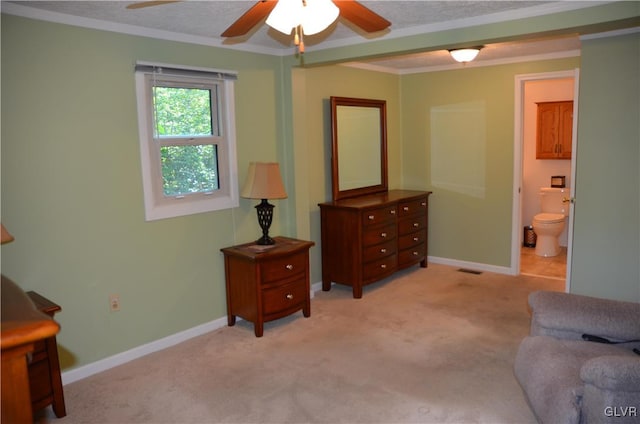 living area featuring ceiling fan, a textured ceiling, light carpet, and ornamental molding