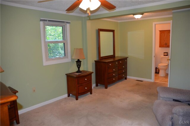 living area with light carpet, baseboards, crown molding, and ceiling fan