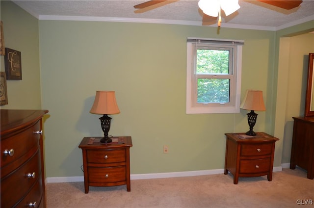 carpeted bedroom with ornamental molding, a textured ceiling, and ceiling fan