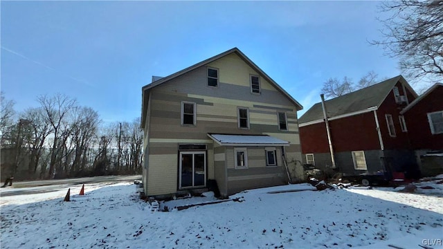 view of snow covered house