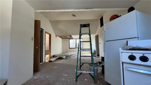 interior space featuring white refrigerator and lofted ceiling