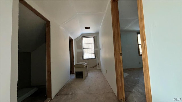 corridor featuring vaulted ceiling