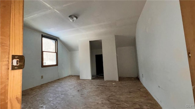 bonus room featuring vaulted ceiling