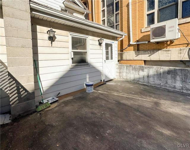 view of property exterior with ac unit and a patio area