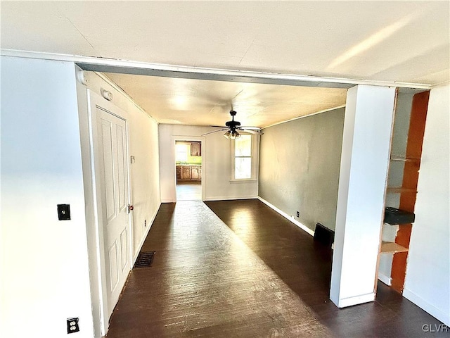 empty room with ceiling fan and dark hardwood / wood-style floors