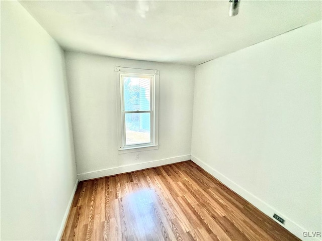 spare room featuring light hardwood / wood-style floors