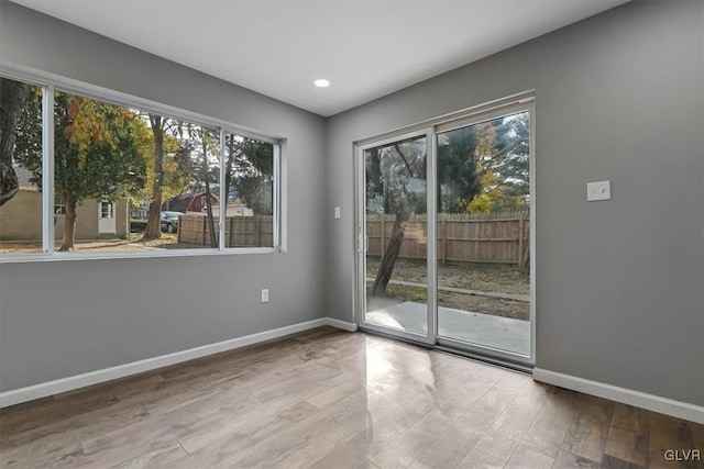 interior space featuring a wealth of natural light and light hardwood / wood-style floors