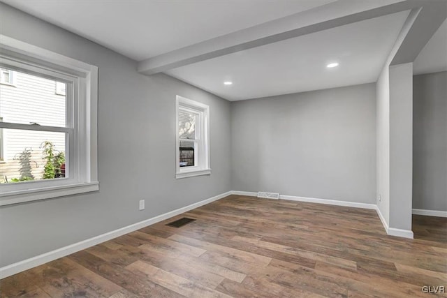 spare room featuring dark hardwood / wood-style floors