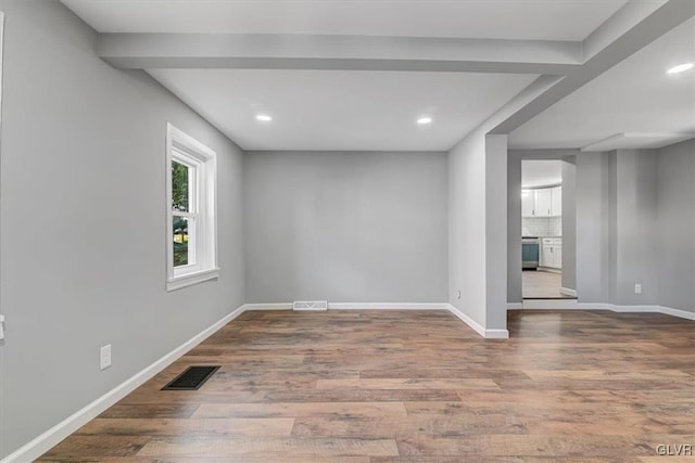 spare room featuring hardwood / wood-style floors