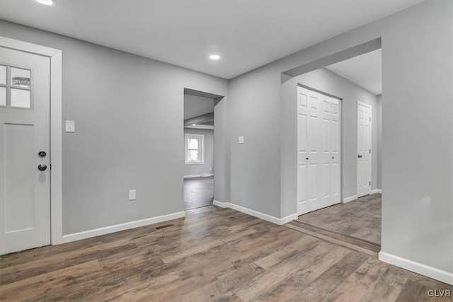 foyer entrance with hardwood / wood-style flooring