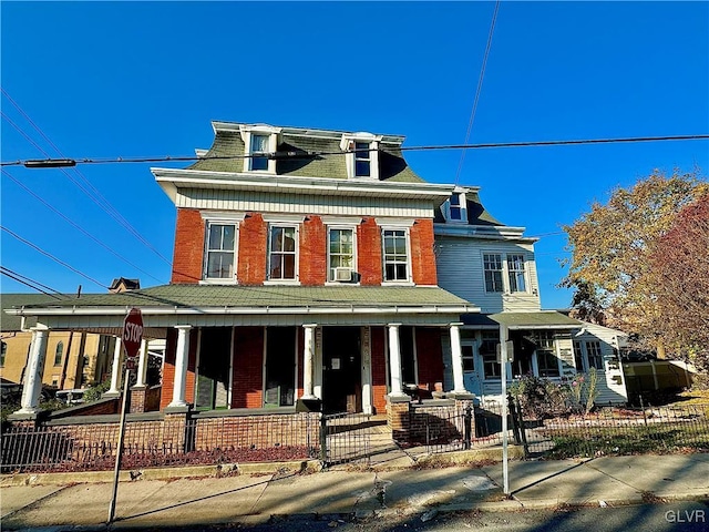 view of front of property with a porch and cooling unit