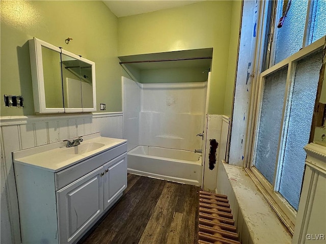 bathroom featuring shower / tub combination, vanity, and hardwood / wood-style flooring