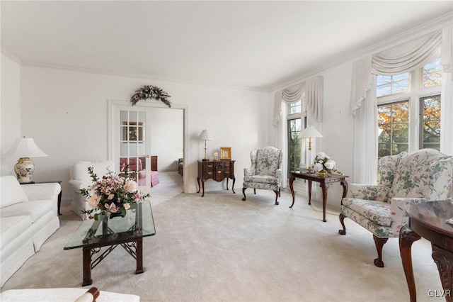 carpeted living room featuring ornamental molding and a wealth of natural light