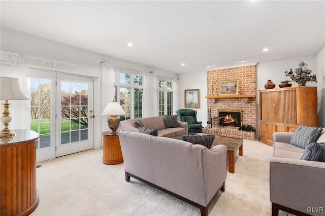 carpeted living room featuring a brick fireplace