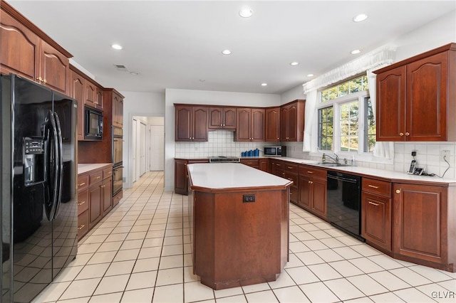 kitchen with a center island, decorative backsplash, black appliances, sink, and light tile patterned flooring