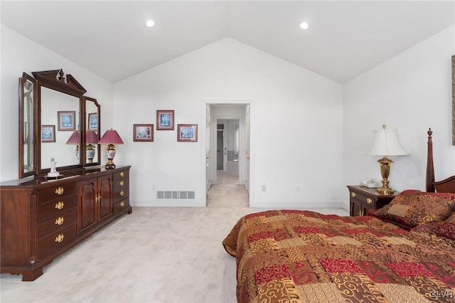 bedroom featuring light carpet and vaulted ceiling