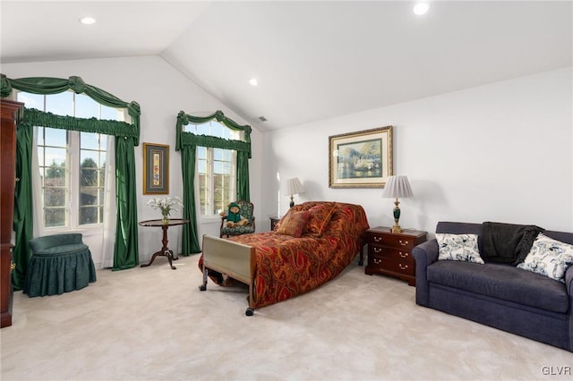 bedroom with light carpet and vaulted ceiling