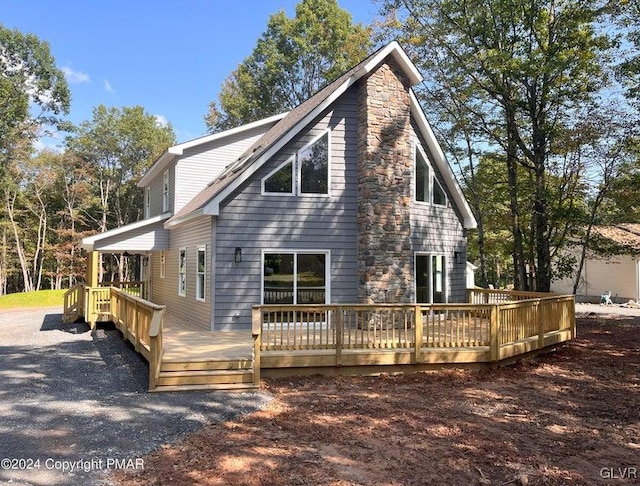 view of property exterior featuring a wooden deck