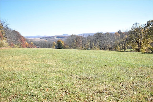 view of mountain feature with a rural view