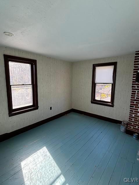 unfurnished room featuring hardwood / wood-style floors