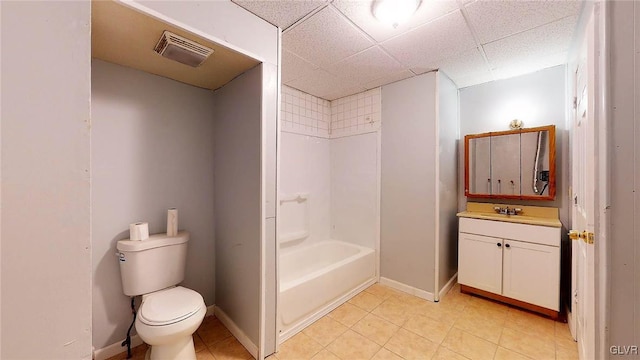 full bathroom featuring toilet, tile patterned floors,  shower combination, a paneled ceiling, and vanity