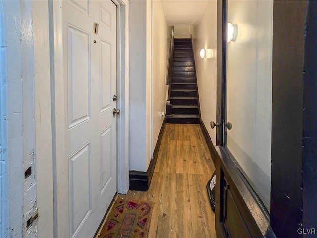 corridor with light hardwood / wood-style floors