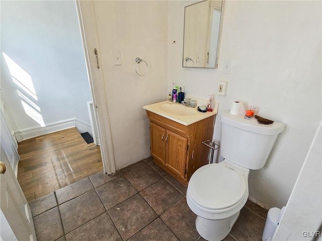 bathroom featuring hardwood / wood-style floors, vanity, and toilet