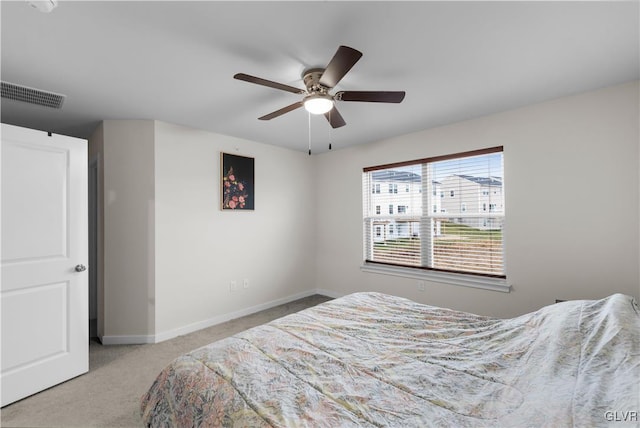 bedroom with light colored carpet and ceiling fan