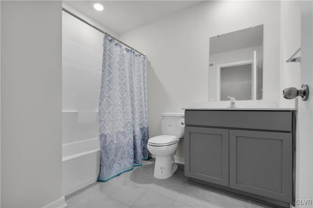 full bathroom with vanity, shower / bath combo, and toilet