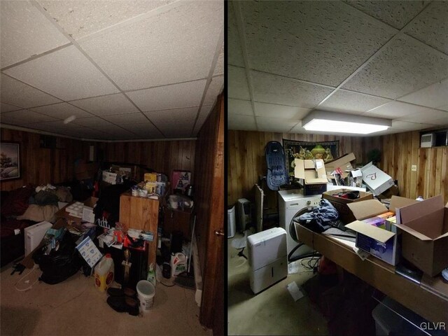 basement with wooden walls and a drop ceiling