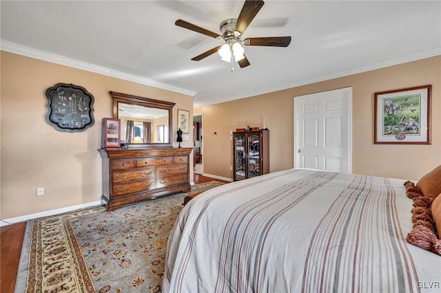 bedroom featuring ceiling fan, crown molding, and wood-type flooring