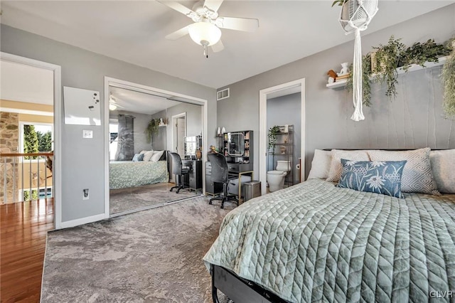 bedroom featuring wood-type flooring, ceiling fan, and a closet