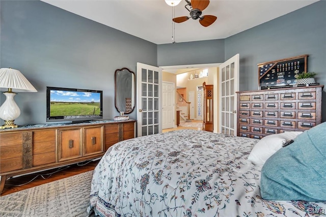 bedroom with dark wood-type flooring and ceiling fan