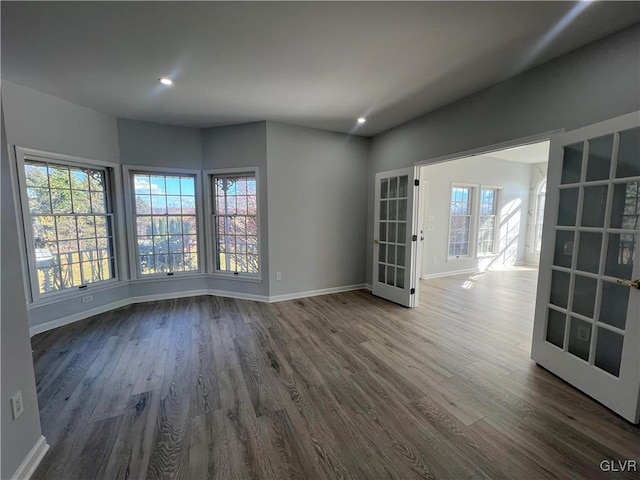 unfurnished room with french doors and hardwood / wood-style flooring