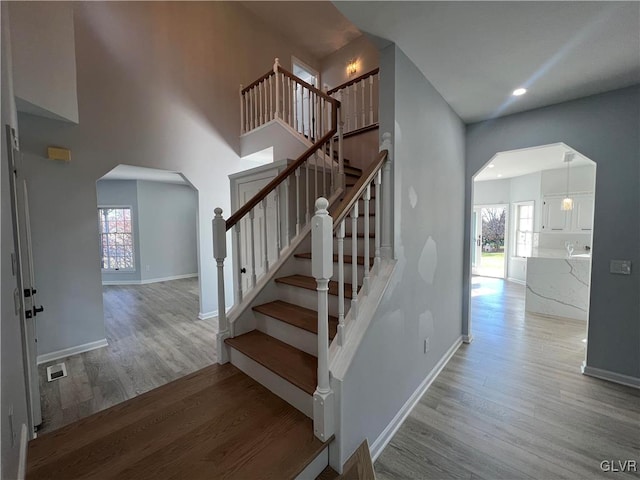 staircase with wood-type flooring