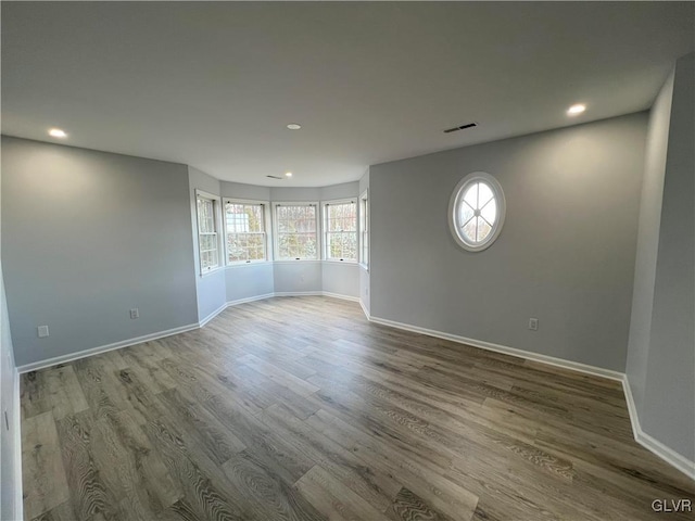 unfurnished room featuring wood-type flooring