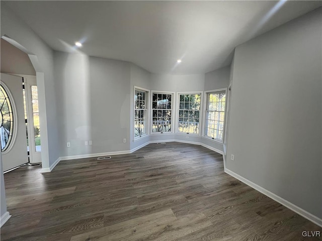 entryway with dark hardwood / wood-style flooring