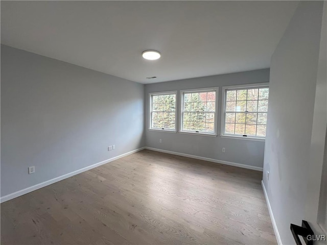 spare room featuring hardwood / wood-style flooring