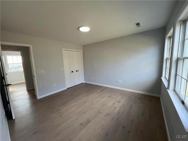 unfurnished room featuring hardwood / wood-style floors