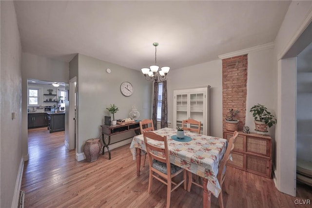 dining area with a chandelier and hardwood / wood-style flooring