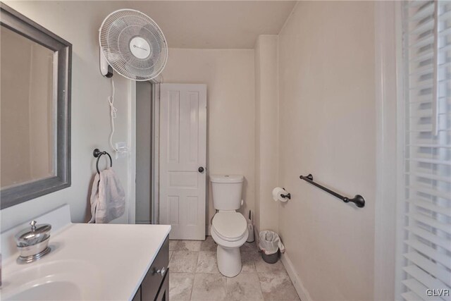 bathroom with toilet and vanity