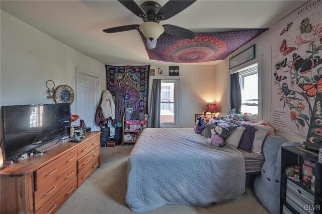 carpeted bedroom with ceiling fan