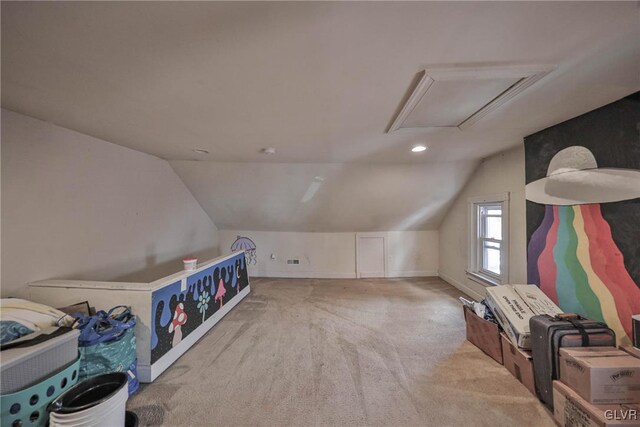 additional living space featuring light carpet and vaulted ceiling