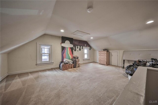 bonus room featuring a wealth of natural light, light colored carpet, and vaulted ceiling