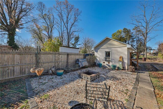 view of yard with a fire pit