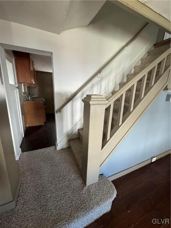 staircase featuring hardwood / wood-style flooring