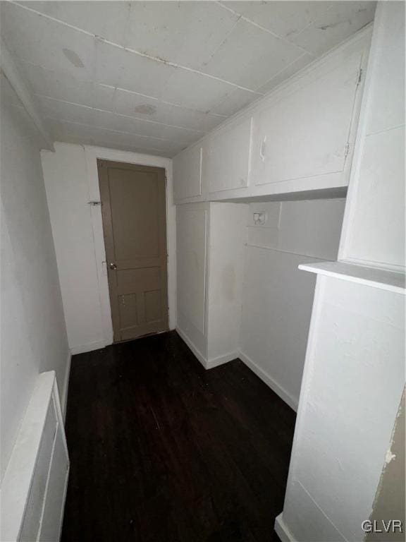 empty room with dark hardwood / wood-style floors