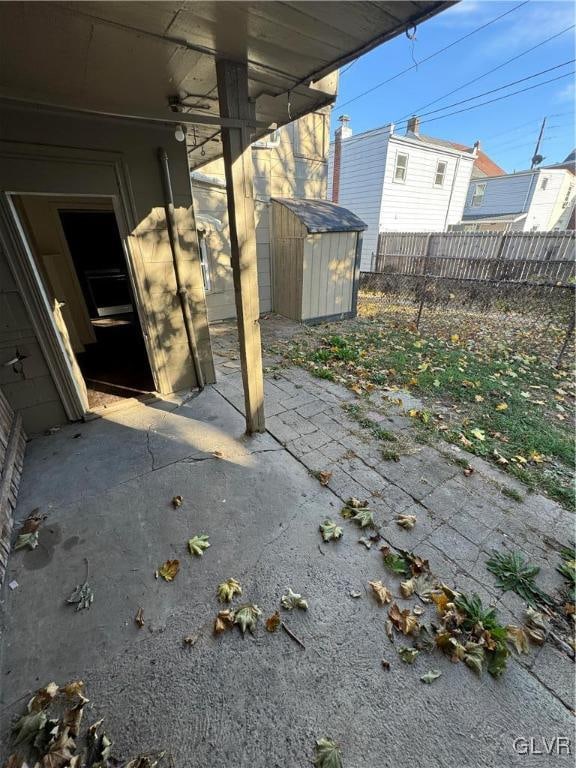 view of patio / terrace featuring a shed