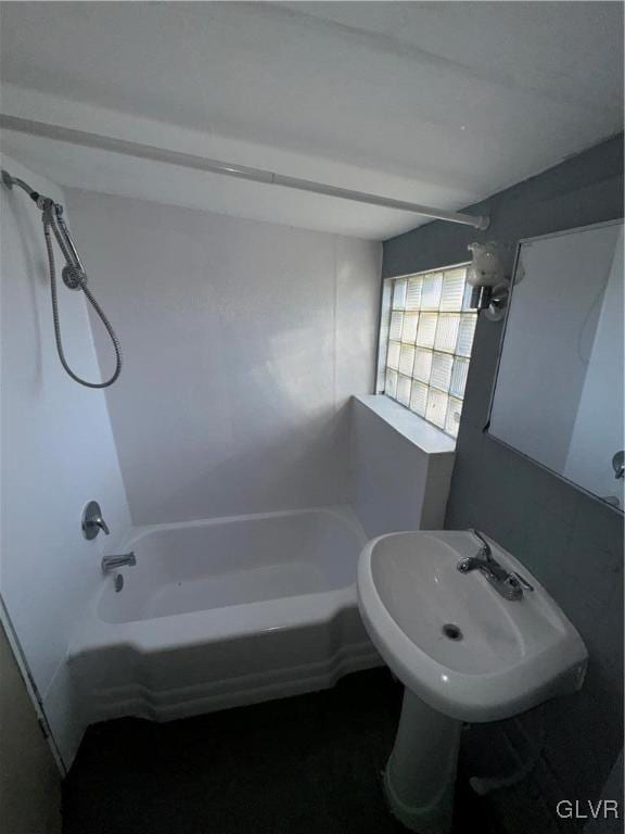 bathroom featuring sink and tub / shower combination