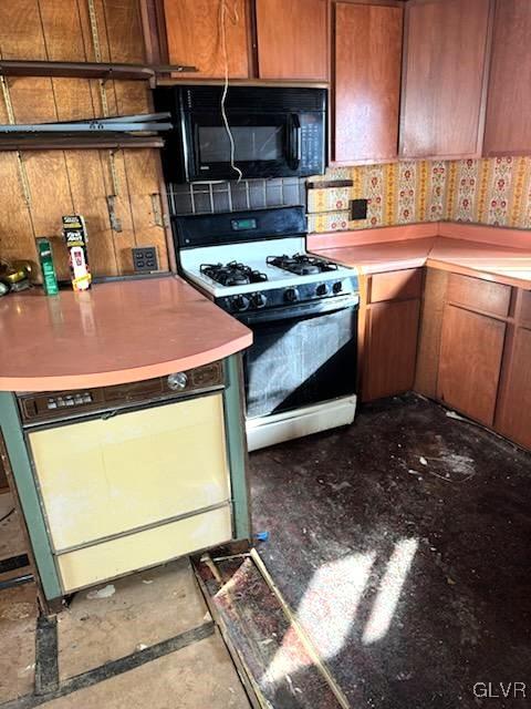 kitchen with white range with gas stovetop